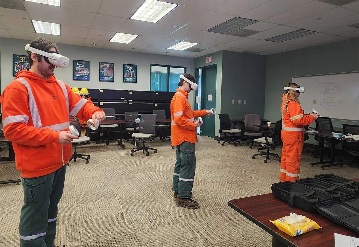 Toronto Hydro crew members in safety gear training with VR headsets in a classroom